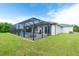 A screened pool and patio area offer outdoor living opportunities in this house at 13344 Gershwin Ln, Port Charlotte, FL 33981