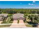An aerial view of the home showcasing the landscaping and the property's location at 13392 Abercrombie Dr, Englewood, FL 34223