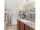 Bathroom featuring a neutral walls, a mirror and granite counters at 13392 Abercrombie Dr, Englewood, FL 34223