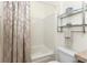 Cozy bathroom featuring a shower/tub combination, neutral color palette, and classic fixtures at 13392 Abercrombie Dr, Englewood, FL 34223