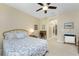 Bedroom featuring a bed, ceiling fan, and carpeted floors at 13392 Abercrombie Dr, Englewood, FL 34223