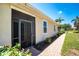 Exterior side view of the property highlighting the landscaping and architecture of the home at 13392 Abercrombie Dr, Englewood, FL 34223