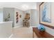 Inviting foyer with neutral paint and decor and a tiled floor at 13392 Abercrombie Dr, Englewood, FL 34223