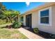 Charming front entrance with a screened door, brick path, and manicured landscaping at 13392 Abercrombie Dr, Englewood, FL 34223