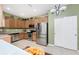Modern kitchen featuring stainless steel appliances, light wood cabinets, and a bright and airy atmosphere at 13392 Abercrombie Dr, Englewood, FL 34223