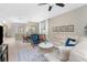 Inviting living room with comfortable seating, neutral colors, and abundant natural light at 13392 Abercrombie Dr, Englewood, FL 34223