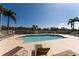 A view of the community pool surrounded by lounge chairs offering relaxation and entertainment at 13392 Abercrombie Dr, Englewood, FL 34223