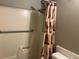 Bathroom with a shower and accessibility bar at 13561 Darnell Ave, Port Charlotte, FL 33981