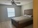 Inviting bedroom featuring a rustic wooden bed frame at 13561 Darnell Ave, Port Charlotte, FL 33981