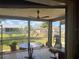 Enclosed patio with view of the backyard and neighboring houses at 13561 Darnell Ave, Port Charlotte, FL 33981