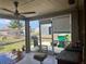 Enclosed patio with a view of a fenced backyard, barbecue, and patio furniture at 13561 Darnell Ave, Port Charlotte, FL 33981