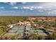 Active community featuring tennis courts, a resort-style pool, and a clubhouse surrounded by lush landscaping at 142 Savona Way, North Venice, FL 34275