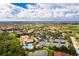 Aerial view of community amenities, including pool, tennis courts, golf course, and manicured landscaping at 142 Savona Way, North Venice, FL 34275