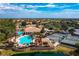 Gorgeous community center with a resort-style pool, tennis courts, and beautifully landscaped grounds at 142 Savona Way, North Venice, FL 34275