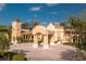 Elegant community center features a grand arched entrance, terracotta roof tiles, and manicured grounds at 142 Savona Way, North Venice, FL 34275