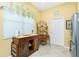 Kitchen area featuring stainless steel refrigerator, ample cabinet space, and tile flooring throughout at 142 Savona Way, North Venice, FL 34275