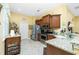 Well-equipped kitchen featuring stainless steel appliances, granite countertops, and convenient bar seating at 142 Savona Way, North Venice, FL 34275