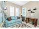 Bright living room with neutral walls, plantation shutters, and stylish decor, creating an inviting and comfortable atmosphere at 142 Savona Way, North Venice, FL 34275