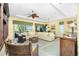 Spacious living room with tile floors, comfortable seating, and bright natural light at 142 Savona Way, North Venice, FL 34275