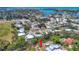 This aerial view showcases the property's location amidst mature trees and waterways, close to a beautiful waterfront at 142 Sunaire Ter, Nokomis, FL 34275