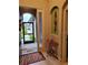 Inviting foyer with decorative accents and a view to the outside at 142 Yellow Pine Dr, Rotonda West, FL 33947
