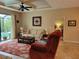 Relaxing living room with large windows and a view of the swimming pool at 142 Yellow Pine Dr, Rotonda West, FL 33947