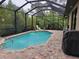 Captivating pool area with a screened enclosure, offering both privacy and protection for year-round enjoyment at 142 Yellow Pine Dr, Rotonda West, FL 33947
