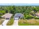 Expansive aerial view of a single Gathering home with pool and lush surroundings at 143 Crevalle Rd, Rotonda West, FL 33947