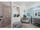 Elegant bathroom featuring a shower, luxurious tub, marble countertops, and chic fixtures at 143 Crevalle Rd, Rotonda West, FL 33947