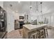 Bright kitchen with an island, pendant lighting, and modern appliances at 143 Crevalle Rd, Rotonda West, FL 33947
