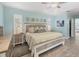 Beautiful bedroom with cool wall color and a ceiling fan at 143 Crevalle Rd, Rotonda West, FL 33947
