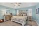 Cozy bedroom featuring a ceiling fan, decorative lamps, and cool wall color at 143 Crevalle Rd, Rotonda West, FL 33947