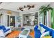 Inviting sunroom leading to the living room, with comfortable seating and stylish decor at 143 Crevalle Rd, Rotonda West, FL 33947
