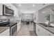 Bright kitchen featuring stainless appliances, granite countertops, and a breakfast nook at 149 Garland Way, Rotonda West, FL 33947