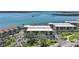 An aerial view highlights this waterfront condo with lush landscaping and nearby amenities at 1501 Beach Rd # 303, Englewood, FL 34223