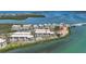 Stunning aerial view of waterfront condominiums, showcasing the coastal setting and community amenities at 1501 Beach Rd # 303, Englewood, FL 34223