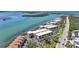 Aerial view shows condos on a waterfront, boasting stunning views and convenient access to the coast at 1501 Beach Rd # 303, Englewood, FL 34223