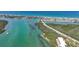 Stunning aerial view showcasing turquoise waters, a scenic bridge, and the coastal community nearby at 1501 Beach Rd # 303, Englewood, FL 34223