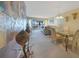 Dining area open to living space, with access to a waterfront balcony and room for entertaining at 1501 Beach Rd # 303, Englewood, FL 34223
