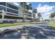 Exterior view of condos highlighting well-maintained landscaping and convenient parking at 1501 Beach Rd # 303, Englewood, FL 34223
