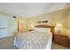 Bedroom with queen bed and two nightstands and lamp at 1501 Beach Rd # 303, Englewood, FL 34223