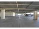 Spacious parking garage with ample parking spots and storage lockers for residents at 1501 Beach Rd # 303, Englewood, FL 34223