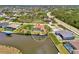 Waterfront property with pool, private dock, and canal access, highlighted in a circular view of the neighborhood at 15020 Acorn Cir, Port Charlotte, FL 33981