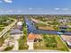 Waterfront home with boat dock boasts mature landscaping and easy access to the canal and Gulf at 15020 Acorn Cir, Port Charlotte, FL 33981