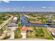 Charming waterfront home boasts mature landscaping and easy access to the canal and Gulf of Mexico at 15020 Acorn Cir, Port Charlotte, FL 33981