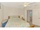 Bedroom with a double bed and an access door; includes a nightstand with lamp at 15020 Acorn Cir, Port Charlotte, FL 33981