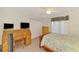 Bedroom with a double bed, a desk, and a dresser; includes closet with double doors at 15020 Acorn Cir, Port Charlotte, FL 33981