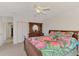 Bedroom with double bed, dresser, and access door to bathroom at 15020 Acorn Cir, Port Charlotte, FL 33981
