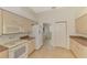Well-lit kitchen with modern appliances, neutral cabinets, and a practical layout at 15020 Acorn Cir, Port Charlotte, FL 33981