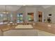Bright kitchen boasts a large sink and a view of the pool and outdoor living area at 15020 Acorn Cir, Port Charlotte, FL 33981